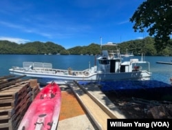 A fishing boat that belongs to the Belau Offshore Fishers Inc. docks by the shore on Palau’s Malakal Island, Oct.16, 2024.