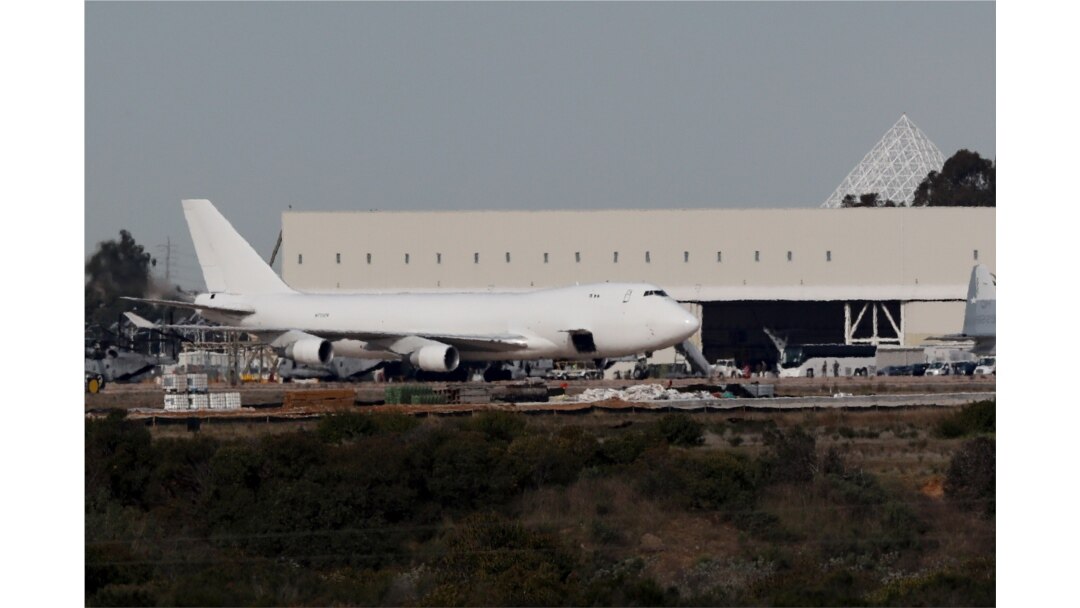 A plane carrying evacuees from the virus zone in China arrives at Marine Corps Air Station Miramar, Feb. 5, 2020, in San Diego, California.