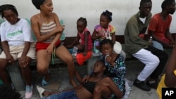 An asthmatic miss  rests arsenic  she takes refuge successful  a backstage  schoolhouse  serving arsenic  a structure  for residents fleeing pack  unit   successful  the Nazon neighborhood, successful  Port-au-Prince, Haiti, Nov. 14, 2024.