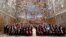 Pope Francis poses for a family photo with diplomats accredited to the Holy See inside the Sistine Chapel, at the end of an audience for the traditional exchange of New Year greetings, at the Vatican, Jan. 8, 2018. 