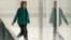 FILE - German Chancellor Angela Merkel walks through a corridor of the Reichstag building during a Christian Union parties faction meeting in Berlin, Sept. 25, 2018.