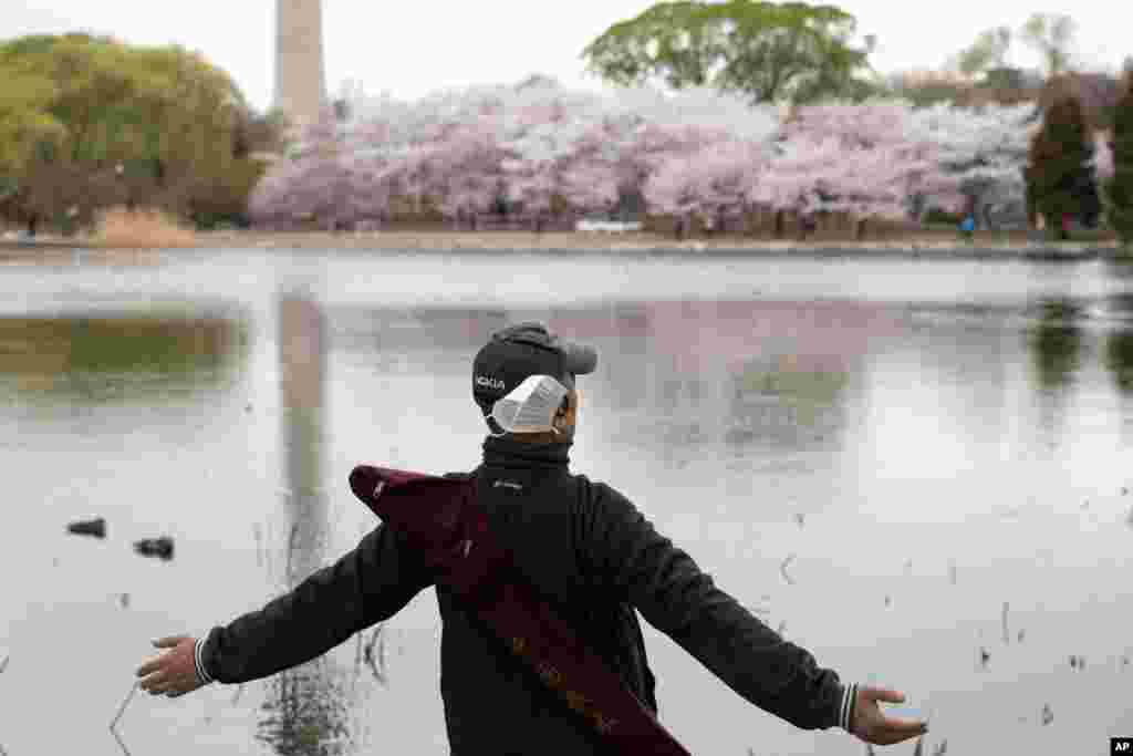 A man stretches at the Yuyuantan Park in Beijing, China.