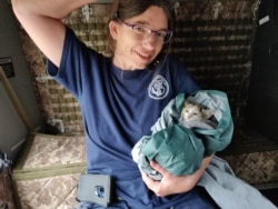 Colleen Udell, President of The Cajun Navy Relief and Rescue sits with a rescued kitten after Hurricane Barry in 2019. (Courtesy: Cajun Navy Relief and Rescue)