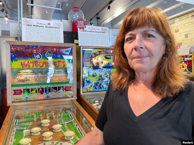 Patty Barber, senior vice president of Silverball Retro Arcade poses in Asbury Park, New Jersey, U.S., August 12, 2022. ((REUTERS/Roselle Chen)