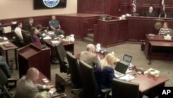 In this image from the Colorado Judicial Department video, Colorado theater shooter James Holmes (top L) in light-colored shirt, sits in Arapahoe County District Court, where his trial continues, July 23, 2015, in Centennial, Colorado.