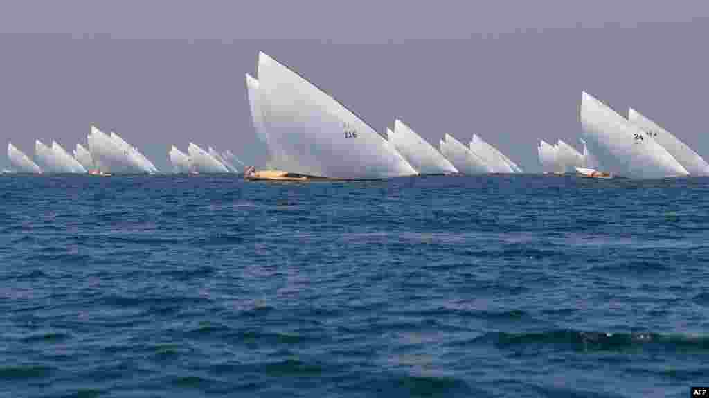 Competitors sail their boats in the annual long-distance "60ft Dubai Traditional Dhow Sailing Race" in the United Arab Emirates, March 7, 2020.