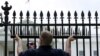 FILE - U.S. government contractors begin the installation of additional security spikes on the existing White House perimeter fence in Washington, July 1, 2015.