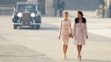 Spain's Queen Letizia, left, walks with Juliana Awada, the wife of Argentina's President Mauricio Macri, during a welcome ceremony at the Royal Palace in Madrid.