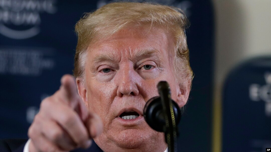 In this Jan. 22, 2020 photo, President Donald Trump speaks during a news conference at the World Economic Forum in Davos, Switzerland. T