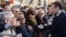 French president Emmanuel Macron meets residents as he walks to the city hall of Ajaccio, Feb. 6, 2018 in Corsica. Macron made a vibrant plea for the unity of the French Republic as he arrived Tuesday for a two-day visit.