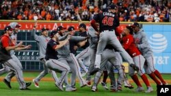 The Washington Nationals celebrate after Game 7 of the baseball World Series against the Houston Astros Wednesday, Oct. 30, 2019, in Houston. The Nationals won 6-2 to win the series. (AP Photo/Matt Slocum)