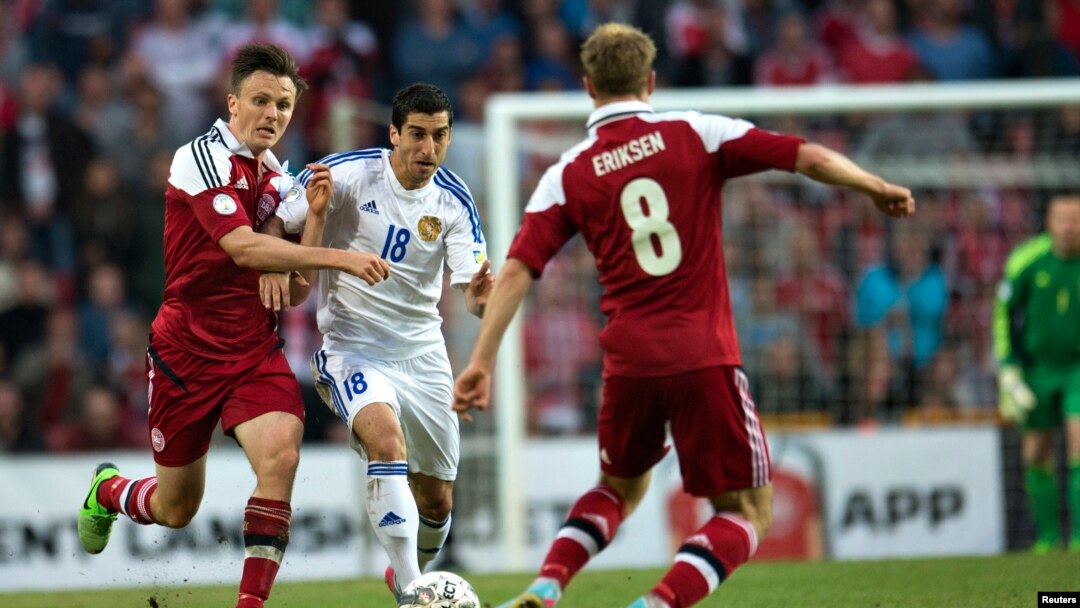 Armenia's Henrik Mkhitaryan (2nd L) fights for the ball with Denmark's William Kvist (L) and Christian Eriksen during their 2014 World Cup qualifying soccer match in Copenhagen June 11, 2013. REUTERS/Jens Noergaard Larsen/Scanpix Denmark (DENMARK - Tags: 