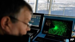 FILE - Radar shows sea ice ahead of the Finnish icebreaker MSV Nordica as chief officer Harri Venalainen navigates the ship through the Beaufort Sea while traversing the Arctic's Northwest Passage, July 16, 2017. 