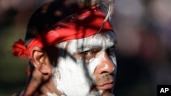 Russell Dawson of the Koomurri Aboriginal Dancers participates in a smoking ceremony during Australia Day ceremonies in Sydney, Tuesday, Jan. 26, 2021. (AP Photo/Rick Rycroft)