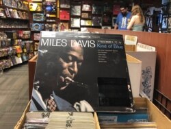 FILE - The "Kind of Blue" album cover is on display at Bull Moose record store in Portland, Maine, August 17, 2019, the 60th anniversary of the album's release.