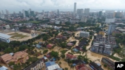 An aerial view shows the flooded George Town city in Penang, Malaysia, Nov. 5, 2017. A northern Malaysian state has been paralyzed by a severe storm that led to two deaths and some 2,000 people evacuated in the worst flooding in years, officials say.