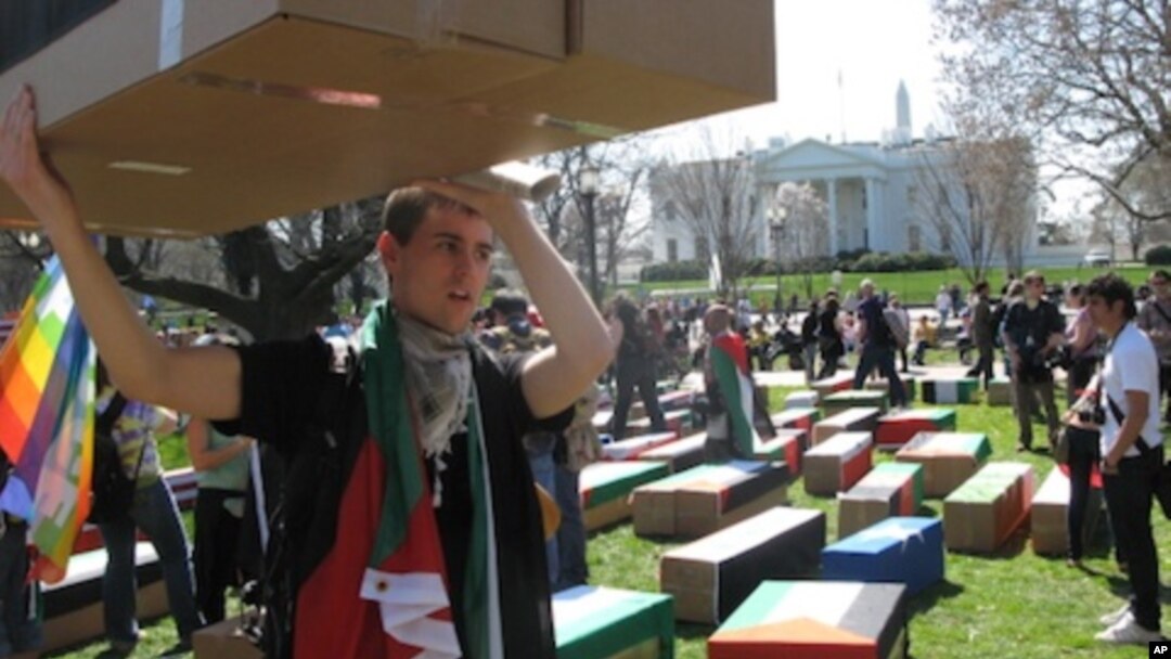 Protesters carried symbolic coffins to mark their opposition to U.S. military action.