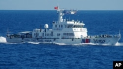 In this photo released by the 11th Regional Coast Guard Headquarters of Japan, a Chinese coast guard vessel sails near disputed East China Sea islands, Aug. 6, 2016.