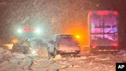 FILE - This image taken Dec 31, 2022 and released by California Highway Patrol Truckee, vehicles stranded are stranded along Interstate 80 at the Nevada State line and Colfax, Calif.