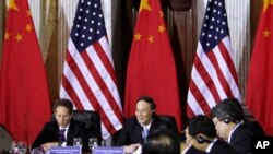 Treasury Secretary Timothy Geithner meets with China's Vice Premier Wang Qishan, center, during the US-China Strategic and Economic Dialogue meetings, Monday, May 9, 2011, at the Treasury Department in Washington. (AP Photo/Jacquelyn Martin)