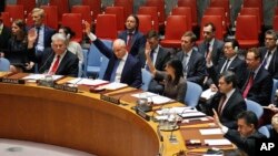 FILE - Ambassadors to the United Nations raise hands in a Security Council resolution vote to sanction North Korea at U.N. headquarters in New York, June 2, 2017.