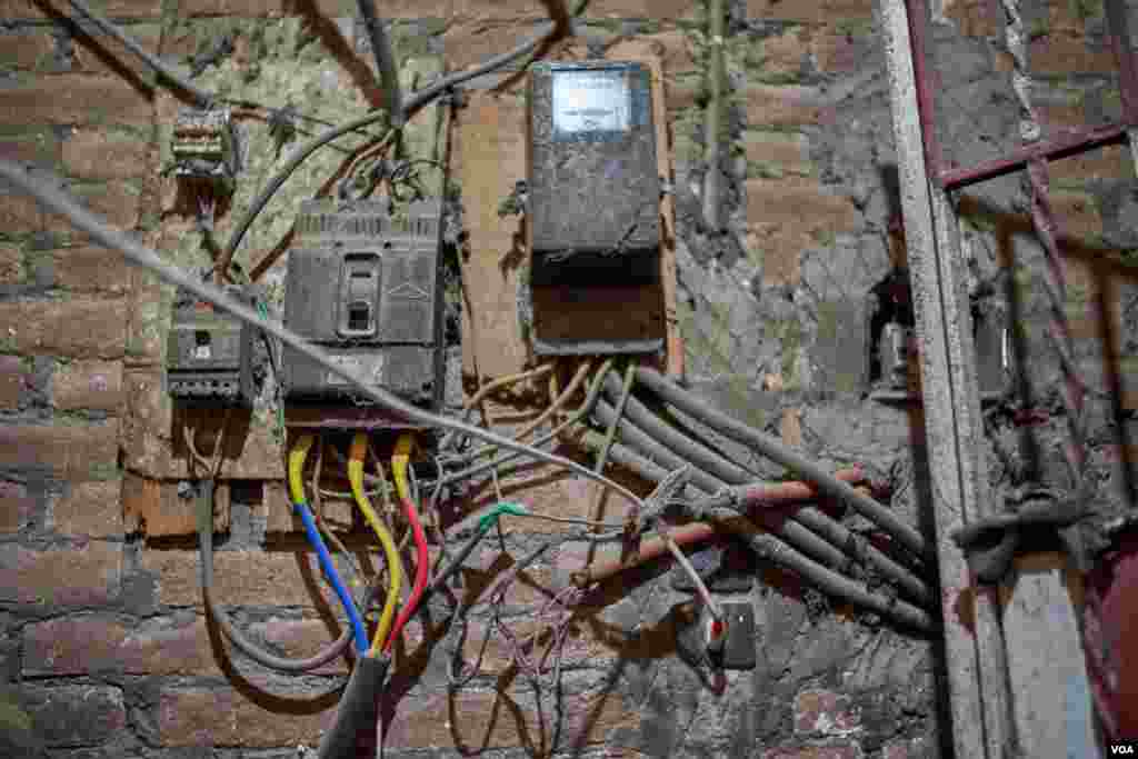 A rigged electricity meter in a Cairo apartment building shows how residents sometimes resort to stealing to save money on electric bills. (H. Elrasam/VOA)