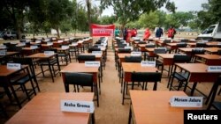 FILE - Names of missing Chibok schoolgirls kidnapped by Boko Haram insurgency five years ago are displayed in Abuja, Nigeria, April 14, 2019. 