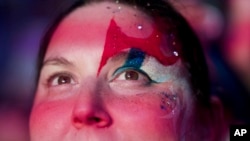 A supporter of Frente Amplio presidential candidate Yamandu Orsi attends a rally five days ahead of elections in Montevideo, Oct. 22, 2024.