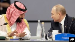 Saudi Arabia's Crown Prince Mohammed bin Salman, left, and Russia's President Vladimir Putin speak at the start of the G20 summit in Buenos Aires, Argentina.