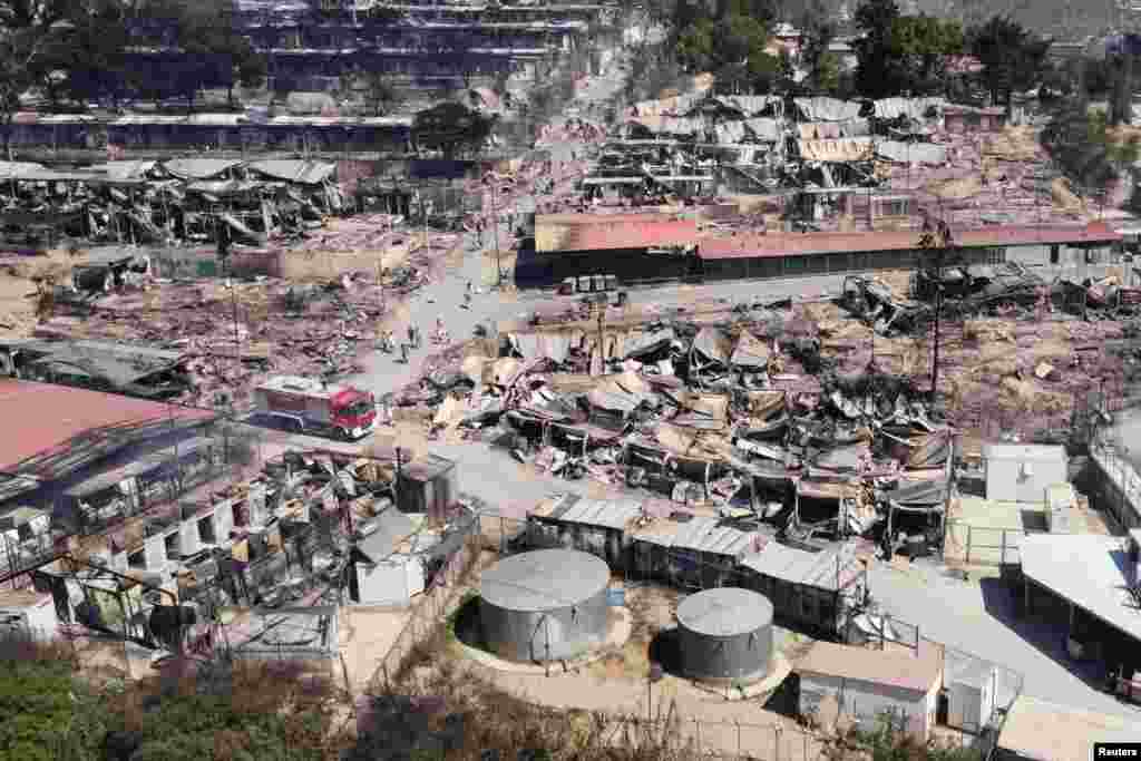 This image shows destroyed shelters following a fire at the Moria camp for refugees and migrants on the Island of Lesbos, Greece.