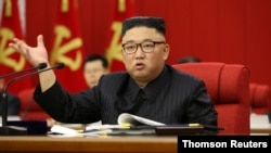 North Korean leader Kim Jong Un speaks during the opening of the 3rd Plenary Meeting of the 8th Central Committee of the Workers' Party of Korea