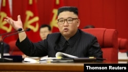 In this image distributed by the North Korean government, North Korean leader Kim Jong Un speaks during the 3rd Plenary Meeting of the 8th Central Committee of the Workers' Party of Korea in Pyongyang, North Korea, June 17, 2021.