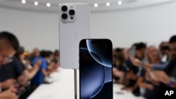 The new iPhone 16 is displayed during an announcement of new products at Apple headquarters Monday, Sept. 9, 2024, in Cupertino, Calif. (AP Photo/Juliana Yamada)