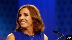 U.S. Rep. Martha McSally, R-Ariz., goes over the rules in a television studio prior to a televised debate with U.S. Rep. Kyrsten Sinema, D-Ariz., Oct. 15, 2018, in Phoenix. 