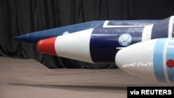 FILE - Missiles are seen on display at an unidentified location in Yemen in this undated handout photo released by the Houthi Media Office, Sept. 17, 2019. The U.S. reportedly seized some suspected Iranian guided missile parts headed to the rebel group. 