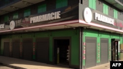 This photograph shows a pharmacy partially reopened in Le Moule, on the French Caribbean island of Guadeloupe, Oct. 26, 2024.