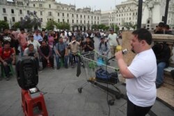 FILE - Congressional candidate Bryan Russell campaigns at San Martin Plaza in Lima, Peru, Dec. 13, 2019.
