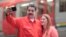 Venezuela's President Nicolas Maduro takes a selfie next to his wife, Cilia Flores, as they arrive for a rally with workers of transport sector in Caracas, Venezuela, Jan. 24, 2018.
