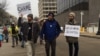 Three anti-Donald Trump protesters.