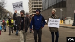 Three anti-Donald Trump protesters.