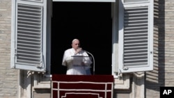 Pope Francis delivers the Angelus noon prayer in St. Peter's Square at the Vatican, Sunday, Nov. 1, 2020. (AP Photo/Gregorio Borgia)