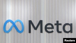 FILE - The logo of Meta is seen at the entrance of the company's temporary stand ahead of the World Economic Forum in Davos, Switzerland, Jan. 18, 2025.