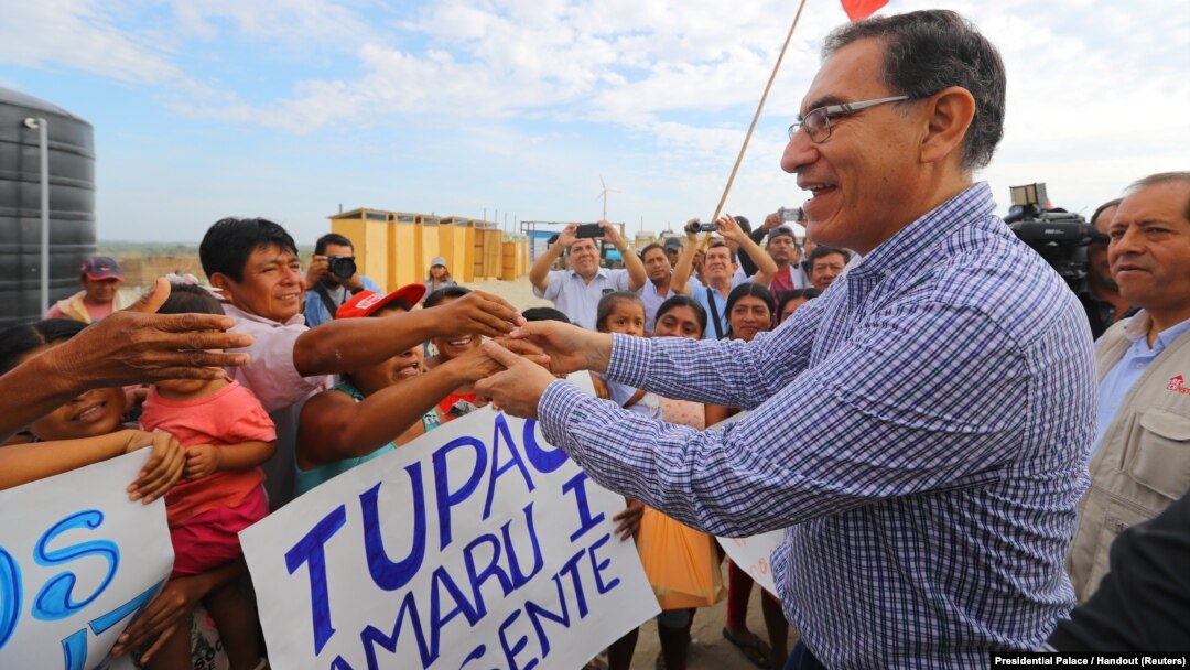 Peruvian President Martin Vizcarra visits flood victims in the northern city of Piura, Peru, March 27, 2018. 