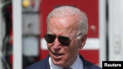 FILE - U.S. President Joe Biden speaks as he tours the facilities of the Flatirons Campus Laboratories and Offices of the National Renewable Energy Laboratory (NREL), in Arvada, Colorado, Sept. 14, 2021.