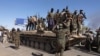 FILE - Sudan's army soldiers celebrate the army's liberation of an oil refinery, in North Bahri, Sudan, Jan. 25, 2025.