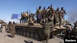 FILE - Sudan's army soldiers celebrate the army's liberation of an oil refinery, in North Bahri, Sudan, Jan. 25, 2025.