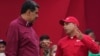 FILE - Venezuelan President Nicolas Maduro, left, speaks with Pedro Tellechea, then the oil minister and president of the Venezuelan state oil company PDVSA, in Caracas, Venezuela, May 1, 2023.