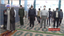 Iranian worshippers wear face masks and adopt the unusual practice of standing apart at a reopened mosque in Rigan County, Kerman province, as seen in a May 5, 2020 report on Iranian state TV.