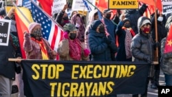 FILE - A group from the Tigrayan diaspora in North America protest about the conflict in Ethiopia, near the State Department, on Dec. 22, 2021, in Washington.