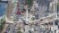 FILE - An aerial view shows a pedestrian bridge collapsed at Florida International University in Miami, March 15, 2018.